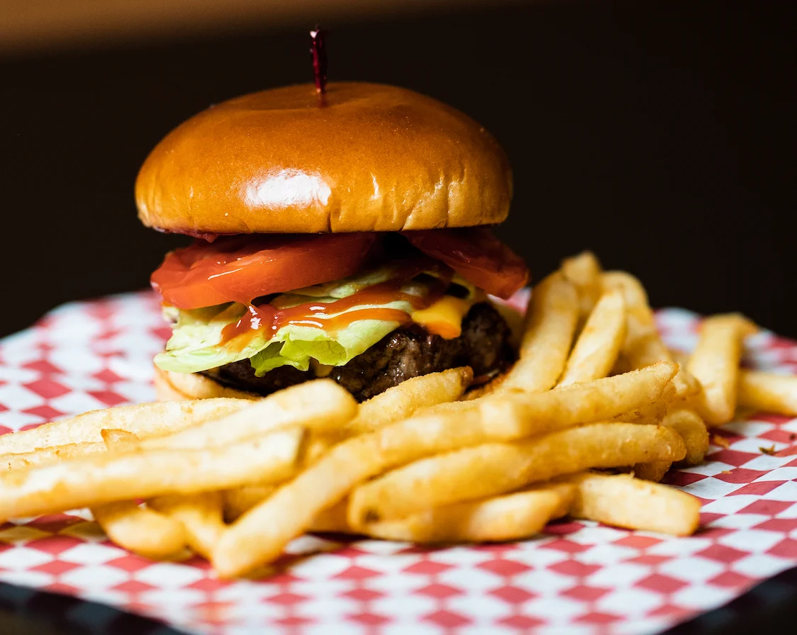 Scorers Plain Jane cheeseburger with lettuce, tomato, onion, pickles, and fries